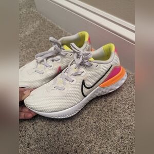 Nike White Athletic Shoes with Black, Pink, and Yellow Accents